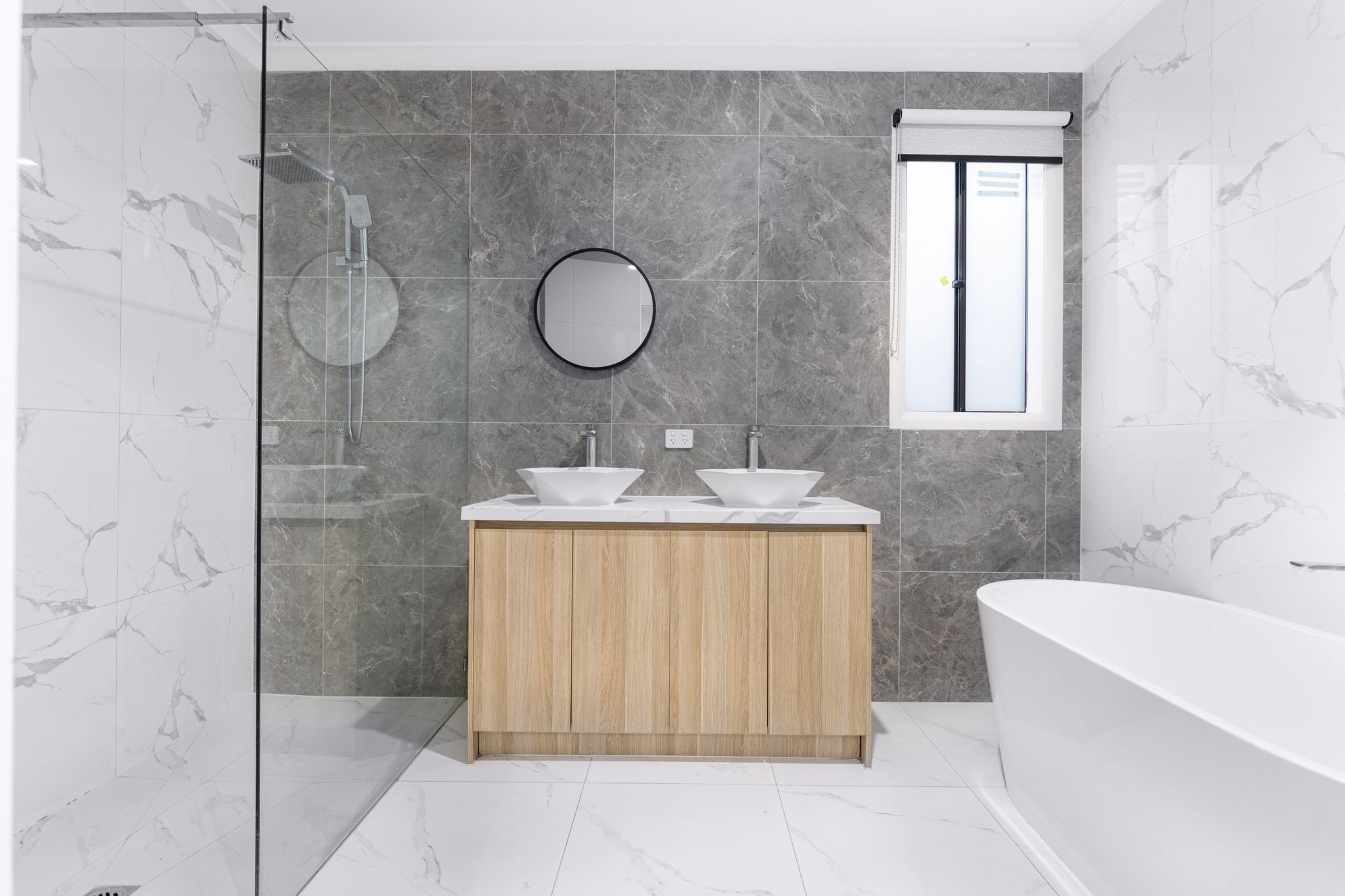 Modern 2026 bathroom renovation with floating vanity and warm tones